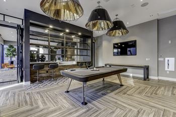 Gaming and social area with billiards, scrabble wall & shuffleboard